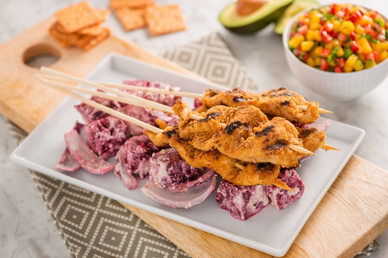 Crunchmaster cracker-coated grilled chicken kabobs with beets, corn relish and avocado.