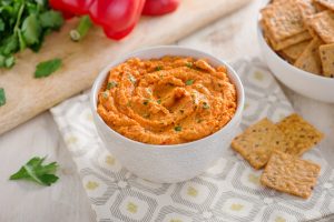 Crunchmaster Multi-Grain crackers with roasted red pepper hummus.