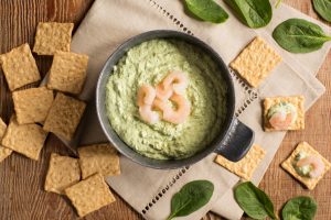 Crunchmaster Multi-Grain crackers with spinach dip and shrimp.