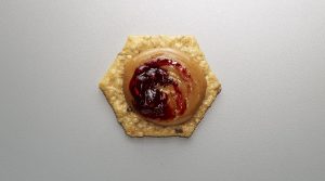 Crunchmaster Multi-Seed cracker with peanut butter and jelly.