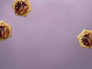 Crunchmaster crackers with purple background.