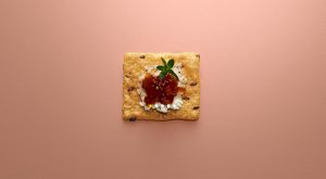 Crunchmaster cracker with jelly on top.